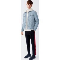 Spodnie tailoring z kontrastowymi lampasami. Żółte spodnie męskie marki Pull&Bear, m, bez wzorów. Za 129,00 zł.