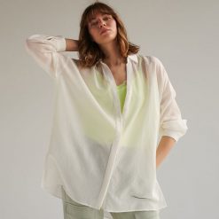 Koszula oversize - Kremowy. Białe koszule damskie Reserved, s, bez wzorów, bez kołnierzyka, bez rękawów. W wyprzedaży za 59,99 zł.