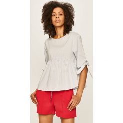 Tommy Jeans - Bluzka. Niebieskie bluzki damskie Tommy Jeans, s, bez wzorów, z bawełny, z okrągłym kołnierzem, bez rękawów. Za 359,90 zł.