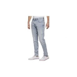 Jeansy straight leg Tommy Jeans DM0DM06621 MODERN TAPARED TJ 19. Niebieskie jeansy męskie Tommy Jeans, m, bez wzorów. Za 407,22 zł.