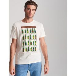 T-shirt z kalendarzem adwentowym - Kremowy. Białe t-shirty męskie Reserved, s, bez wzorów, bez kołnierzyka. Za 39,99 zł.