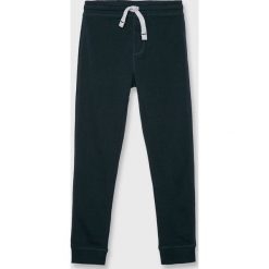 Blukids - Spodnie dziecięce 140-170 cm. Niebieskie spodnie chłopięce Blukids, bez wzorów, z bawełny, casualowe. W wyprzedaży za 39,90 zł.