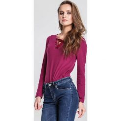 Fioletowa Bluzka Unbreakable. Fioletowe bluzki damskie other, xl, bez wzorów, z dzianiny, klasyczne, z okrągłym kołnierzem, z długim rękawem. Za 29,99 zł.