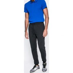 Under Armour - Spodnie. Brązowe spodnie męskie Under Armour, xl, bez wzorów, z bawełny, sportowe. W wyprzedaży za 219,90 zł.