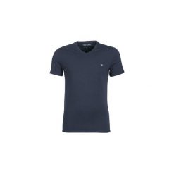T-shirty z krótkim rękawem Guess CORE. Niebieskie t-shirty męskie Guess, s, z aplikacjami, bez kołnierzyka, krótkie. Za 109,00 zł.