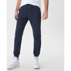 Spodnie typu jogger - Granatowy. Niebieskie spodnie damskie marki House, s. Za 79,99 zł.