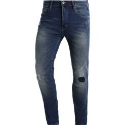Springfield ROTOS Jeansy Slim Fit blues. Niebieskie jeansy męskie relaxed fit marki Springfield, z bawełny. W wyprzedaży za 135,20 zł.