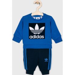 Adidas Originals - Dres dziecięcy 62-104 cm. Niebieskie spodnie chłopięce adidas Originals, z nadrukiem, z elastanu, długie. W wyprzedaży za 139,90 zł.