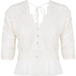 Top LOVESHACKFANCY DEVON. Białe bluzki damskie LoveShackFancy, z haftami, z jeansu, z falbankami. W wyprzedaży za 1221,00 zł.