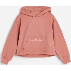 Bawełniana bluza dresowa z kapturem -. Bluzy damskie Reserved, bez wzorów, z bawełny, bez rękawów, z kapturem. Za 49,99 zł.