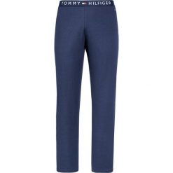 Spodnie dresowe TOMMY HILFIGER UM0UM01186. Niebieskie jeansy męskie TOMMY HILFIGER, m, bez wzorów, z bawełny. Za 199,00 zł.