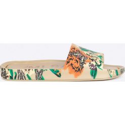Melissa - Klapki Beach Slide III Ad. Żółte klapki damskie marki Melissa, bez wzorów, z materiału, bez obcasa. W wyprzedaży za 219,90 zł.