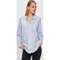 Tommy Jeans - Koszula. Niebieskie bluzki damskie Tommy Jeans, na co dzień, s, bez wzorów, z bawełny, klasyczne, z klasycznym kołnierzykiem, z długim rękawem. W wyprzedaży za 239,90 zł.