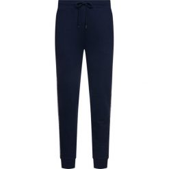 Spodnie dresowe TOMMY HILFIGER UM0UM00706. Szare jeansy męskie TOMMY HILFIGER, xl, bez wzorów. W wyprzedaży za 239,00 zł.