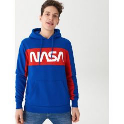 Bluza z kapturem NASA - Niebieski. Niebieskie bluzy męskie House, xl, bez wzorów, z kapturem, bez rękawów, z kapturem. Za 129,99 zł.