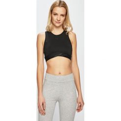 Puma - Top. Czarne topy damskie Puma, s, bez wzorów, z elastanu, z okrągłym kołnierzem. W wyprzedaży za 89,90 zł.
