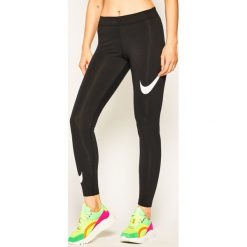 Legginsy NIKE Sportswear Leg-A-See Swoosh CJ2655. Czarne spodnie damskie Nike, s, bez wzorów, z elastanu. Za 129,00 zł.