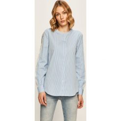 Tommy Hilfiger - Koszula. Białe bluzki damskie TOMMY HILFIGER, na co dzień, bez wzorów, z bawełny, eleganckie, ze stójką, z długim rękawem. W wyprzedaży za 399,90 zł.