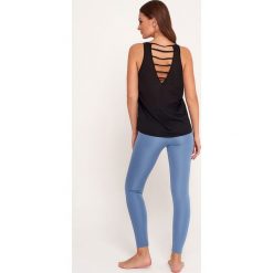 Cardio Bunny - Top sportowy Orisa. Czarne topy damskie Cardio Bunny, xs, bez wzorów, z elastanu, bez rękawów. W wyprzedaży za 49,90 zł.