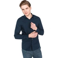 Calvin Klein Koszula Niebieski. Niebieskie koszule męskie Calvin Klein, xxl, bez wzorów, z elastanu, bez kołnierzyka, z długim rękawem. Za 395,95 zł.