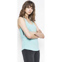 Reebok - Top. Niebieskie topy damskie marki Reebok, s, z elastanu, z okrągłym kołnierzem. W wyprzedaży za 59,90 zł.