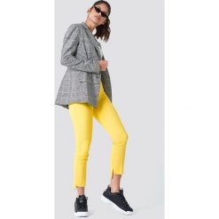 Spodnie z wysokim stanem: Trendyol Spodnie z asymetrycznymi nogawkami – Yellow
