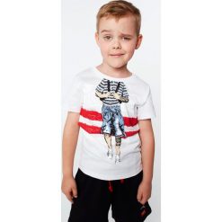 T-shirt chłopięcy z nadrukiem biały NDZ4461. Białe t-shirty chłopięce marki Fasardi, z nadrukiem, bez rękawów. Za 39,00 zł.