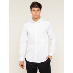 Koszula Armani Exchange 8NZCBD ZN10Z 1100. Białe koszule męskie Armani Exchange, xxl, bez wzorów, z elastanu, biznesowe, bez kołnierzyka, bez rękawów. W wyprzedaży za 199,00 zł.