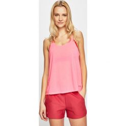 Under Armour - Top. Różowe bluzki damskie Under Armour, s, bez wzorów, z poliesteru, z okrągłym kołnierzem. W wyprzedaży za 99,90 zł.