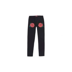 Getry dziewczęce we wzory. Czarne legginsy dziewczęce marki TXM. Za 16,99 zł.