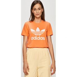 Adidas Originals - T-shirt. Pomarańczowe topy damskie adidas Originals, z nadrukiem, z elastanu, casualowe, z okrągłym kołnierzem. W wyprzedaży za 89,90 zł.