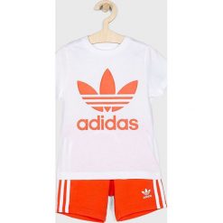 Adidas Originals - Komplet dziecięcy 110-128 cm. Pomarańczowe spodnie chłopięce marki adidas Originals, z nadrukiem, z bawełny. Za 179,90 zł.
