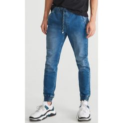 Jeansy ze ściągaczami - Niebieski. Niebieskie jeansy męskie marki Reserved. Za 129,99 zł.
