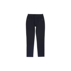 Spodnie damskie legginsy z kieszeniami w kropki. Czarne legginsy we wzory marki TXM. Za 29,99 zł.