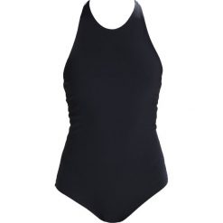 Under Armour CROSS BACK Top black. Czarne topy sportowe damskie marki Under Armour, l, z elastanu. W wyprzedaży za 269,50 zł.