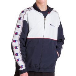 CHAMPION COLOUR BLOCK LOGO TAPE TRIM TRACK > 214050-BS501. Niebieskie kurtki męskie Champion, xxl, bez wzorów, z nylonu, klasyczne, długie, bez kaptura. Za 399,99 zł.
