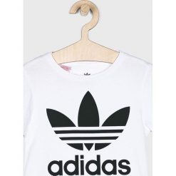 Adidas Originals - Top dziecięcy 104-128 cm. Białe bluzki dziewczęce adidas Originals, z nadrukiem, z bawełny, z okrągłym kołnierzem, z krótkim rękawem, krótkie, bez kaptura. Za 69,90 zł.