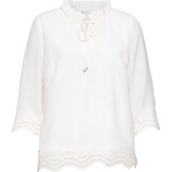 Bluzka z koronką bonprix biel wełny. Białe koszulki damskie bonprix, w koronkowe wzory, z poliesteru, eleganckie, z dekoltem w serek, bez rękawów. Za 84,99 zł.