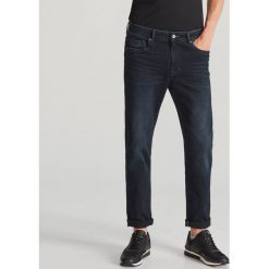Spodnie jeansowe slim - Niebieski. Niebieskie spodnie męskie Reserved, m, bez wzorów, z jeansu. Za 129,99 zł.