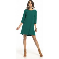 Sukienka trapezowa elegancka szmaragdowa - 36. Zielone sukienki damskie e-margeritka.pl, na co dzień, na wiosnę, xl, bez wzorów, z poliesteru, eleganckie, bez kołnierzyka, z długim rękawem, długie, maxi, proste. Za 138,99 zł.
