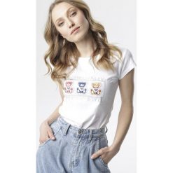 Biały T-shirt Sereinia. Białe bluzki damskie Born2be, s, bez wzorów, bez kołnierzyka, bez rękawów. W wyprzedaży za 49,99 zł.
