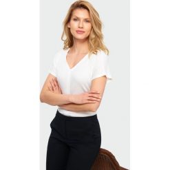 Elegancka bluzka. Bluzki damskie Greenpoint, bez wzorów, z elastanu, eleganckie, bez kołnierzyka, bez rękawów. Za 79,99 zł.