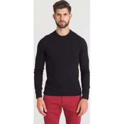 Czarny pulower Emporio Armani. Czarne swetry męskie m, z aplikacjami, z okrągłym kołnierzem. Za 769,50 zł.