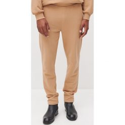 UNISEX Spodnie dresowe z bawełny organicznej -. Spodnie damskie Reserved, s, z bawełny. Za 159,99 zł.