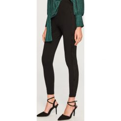 Legginsy z lampasem - Wielobarwn. Czarne legginsy marki TXM. Za 69,99 zł.