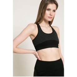 Puma - Biustonosz. Szare biustonosze sportowe Puma, z dzianiny. W wyprzedaży za 69,90 zł.