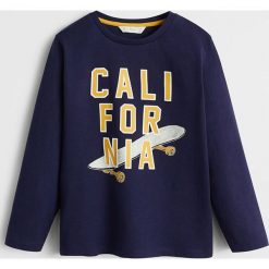 Mango Kids - Longsleeve dziecięcy FIRST 110-164 cm. Białe t-shirty chłopięce Mango Kids, z nadrukiem, z bawełny, bez rękawów. Za 45,90 zł.