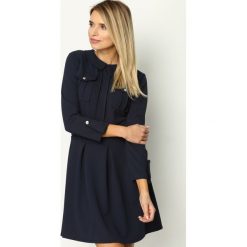 Granatowa Sukienka Restrict. Niebieskie sukienki damskie Born2be, s, bez wzorów, eleganckie, z okrągłym kołnierzem, bez rękawów, mini, rozkloszowane. Za 99,99 zł.