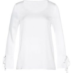 Bluzka bonprix biały. Białe bluzki damskie bonprix, bez wzorów, eleganckie, bez kołnierzyka, bez rękawów. Za 54,99 zł.