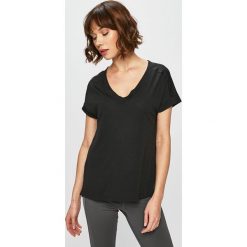 Reebok - Top. Czarne topy damskie Reebok, s, bez wzorów, z poliesteru, casualowe, bez kołnierzyka. W wyprzedaży za 79,90 zł.